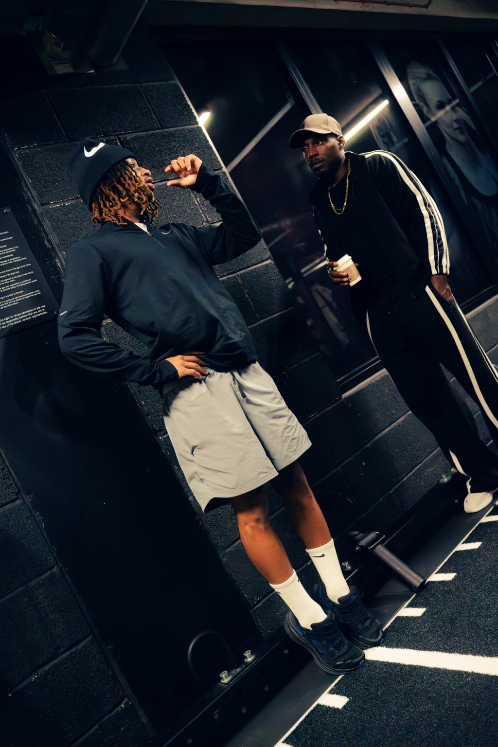 Coach speaking with an athlete during performance training